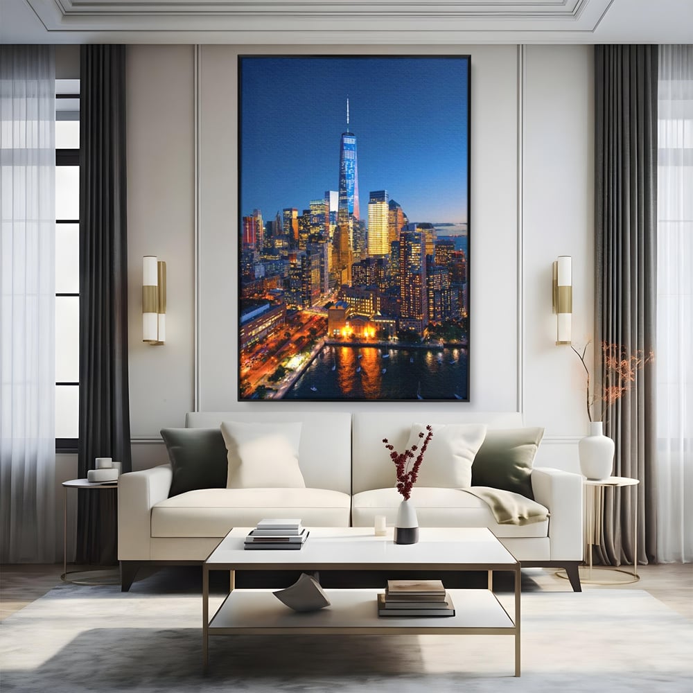 Tablou canvas cu panoramic nocturn cu zghiet-nori din new york, in rama de aluminiu negru, pe perete intr-un living